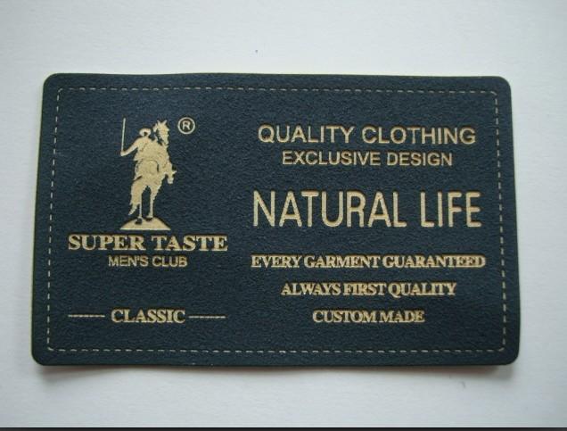 供應(yīng)優(yōu)質(zhì)花紋燙金標(biāo)，花紋燙金商標(biāo)，服裝商標(biāo)，服裝商標(biāo)廠家，衣服商標(biāo)定做。燙金服飾皮標(biāo)燙